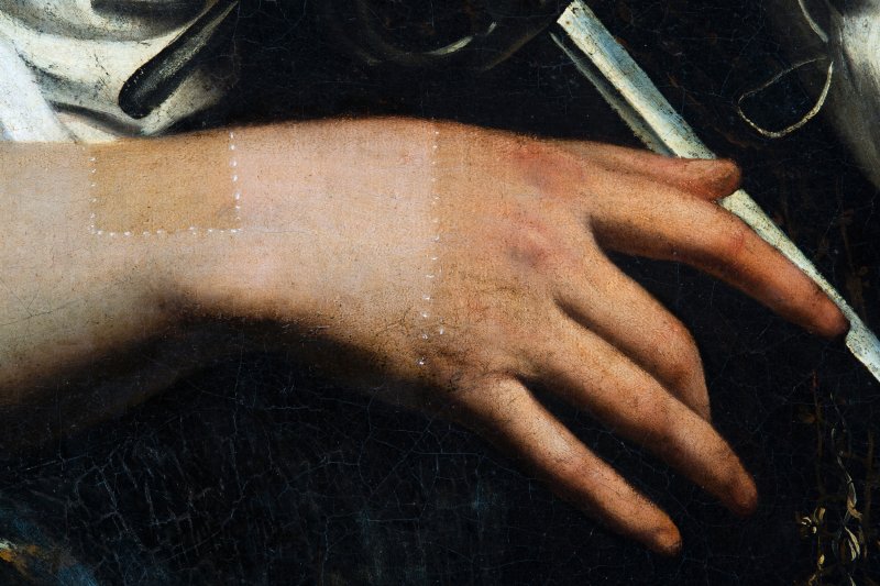 Detalle de la mano durante el proceso de restauración de "Santa Catalina de Alejandría" de Caravaggio