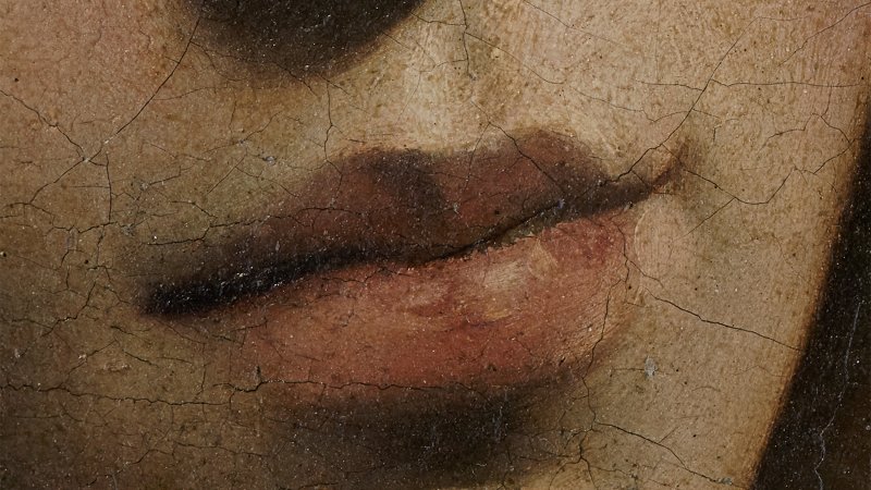Detail in macrophotography of the painting "Saint Catherine of Alexandria" by Caravaggio